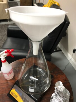 About to pour in the chilled wort and yeast using a sanitized flask/stirbar and sanitized funnel Yeast Starter Process